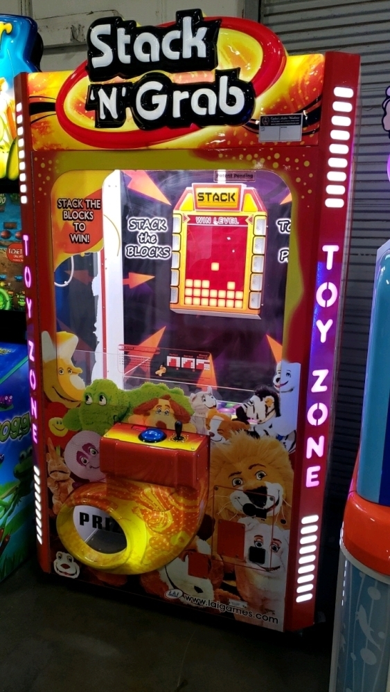 Stack 'N Grab prize game with plush toys in the cabinet