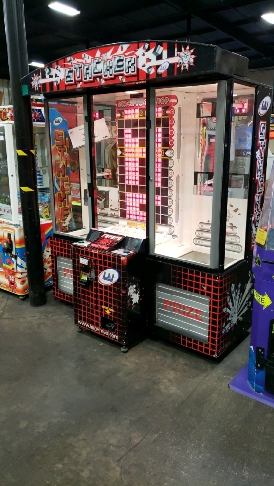 Stacker redemption game with a lit prize column